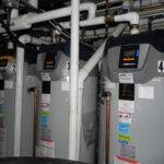 A bank of water heaters in a mechanical room