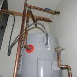 A hot water tank in mechanical closet installed by AireCom